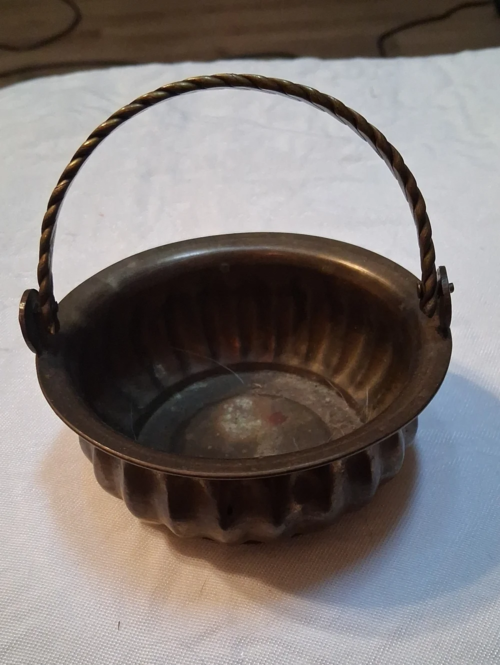 Vintage Brass-Tone Decorative Basket with Twisted Handle